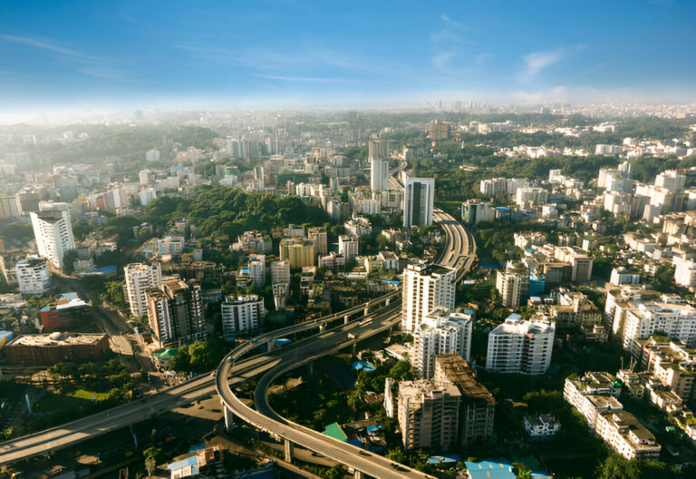 A detailed 3D aerial rendering of a densely populated urban area with high-rise buildings, road networks, and green spaces. This visualization highlights the integration of sustainable design elements, such as parks, eco-friendly structures, and efficient traffic systems, emphasizing the role of 3D rendering in planning modern, sustainable cities.